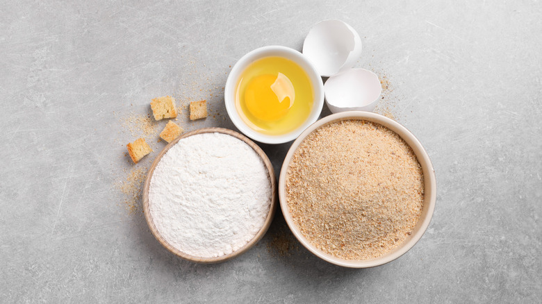 Bowls of flour and breadcrumbs