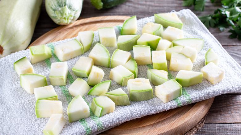 zucchini cubes on a kitchen towel