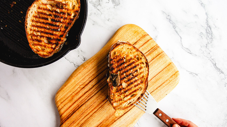 Placing sandwich on cutting board