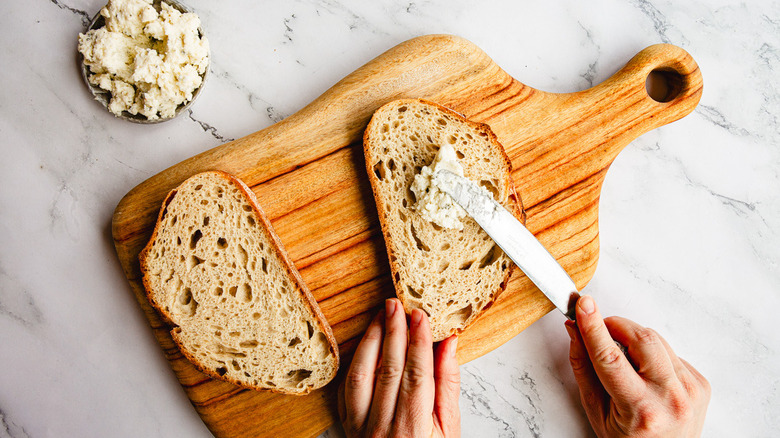 Spreading boursin on bread