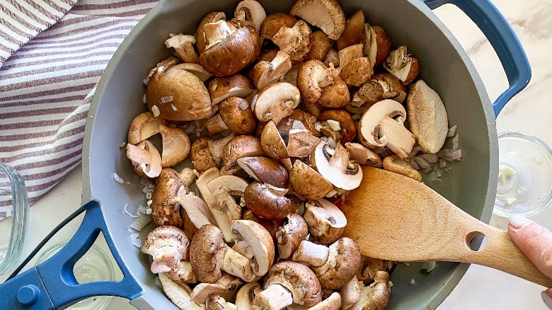 mushrooms and shallots in frying pan