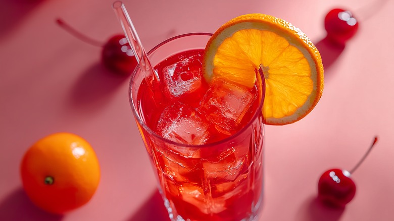 Shirley Temple against pink background.