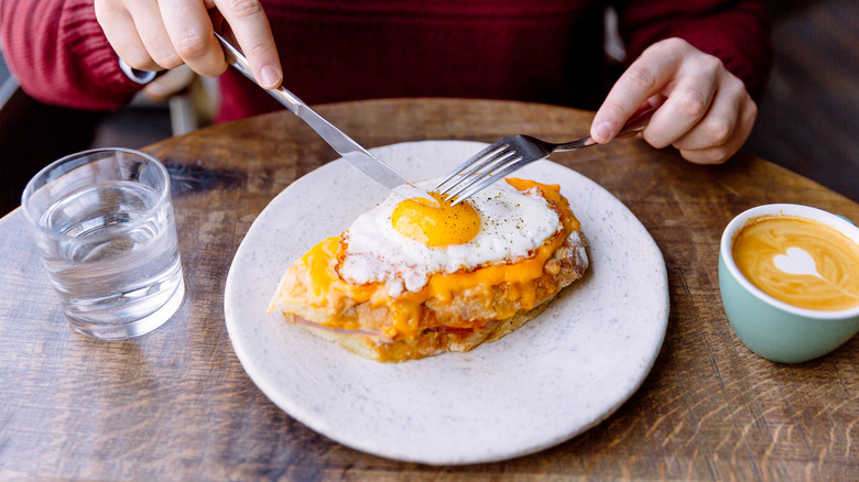 Foodie enjoying a croque madame