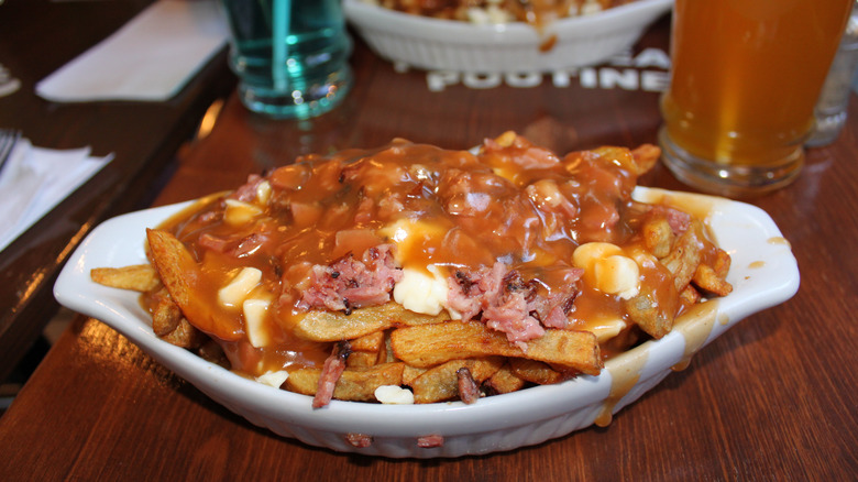 Smoked meat poutine in a bowl