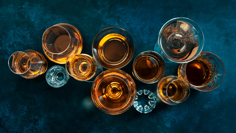 Top-down view of different liquors in glasses