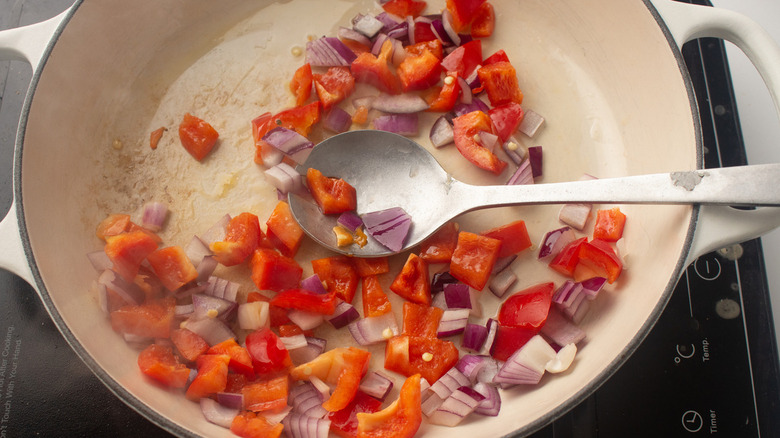 vegetables sautéing in pot