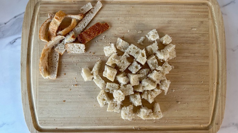 cubed bread on cutting board