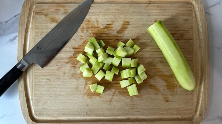 chopped cucumber on cutting board