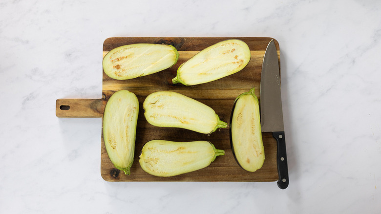 eggplants sliced in half lengthwise