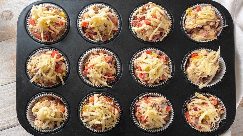 Cheese topped pizza bites in muffin pan