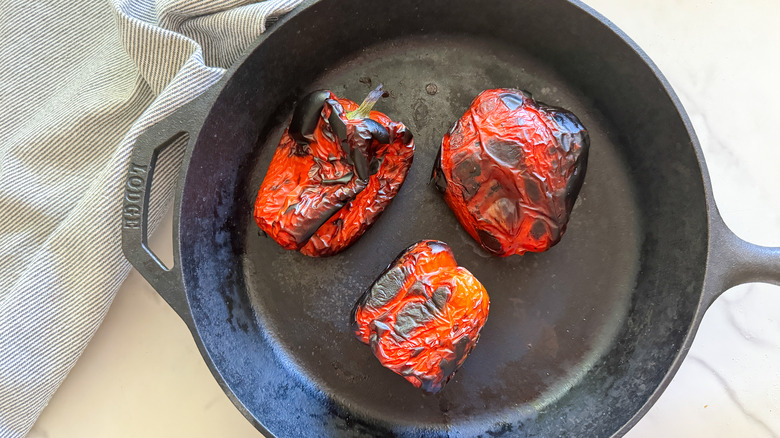 charred peppers in pan