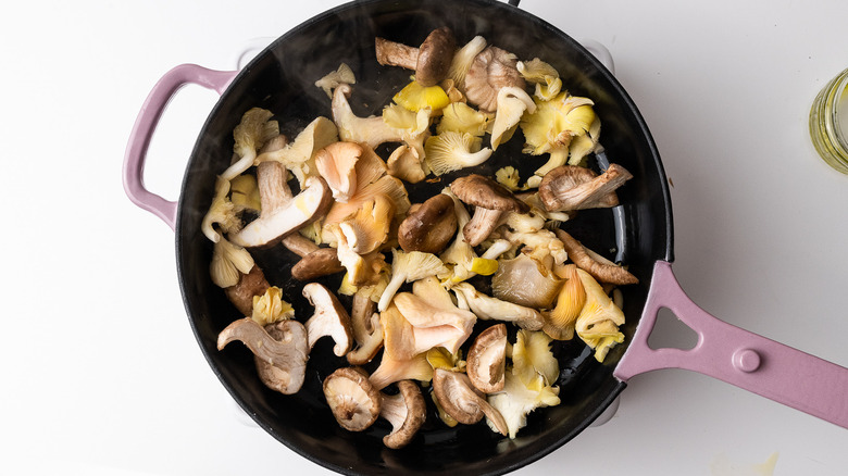 mixed mushrooms in a frying pan