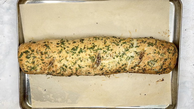 stromboli cooling down on baking sheet