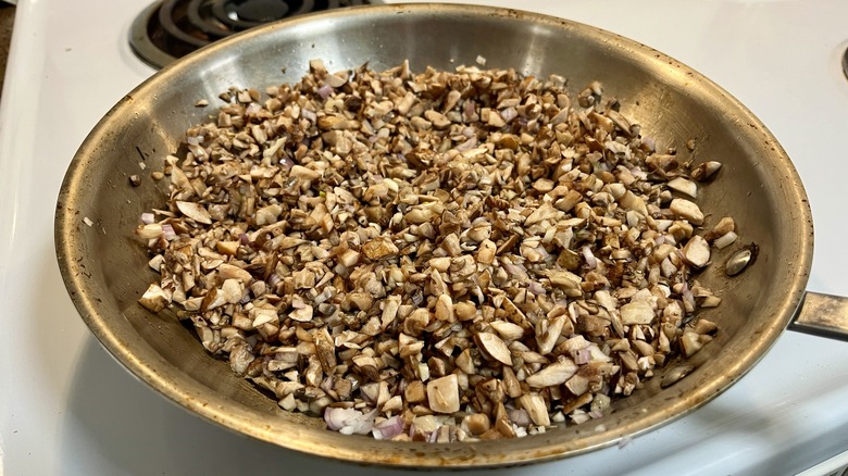 chopped mushrooms in skillet