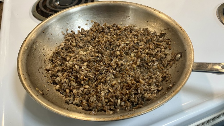 cooked chopped mushrooms in skillet