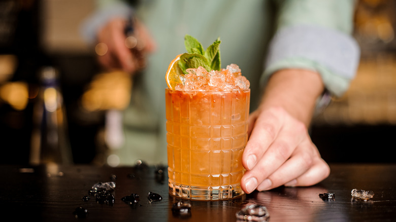 Cocktail with an orange garnish