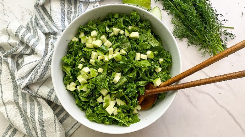 mustard green salad in white bowl