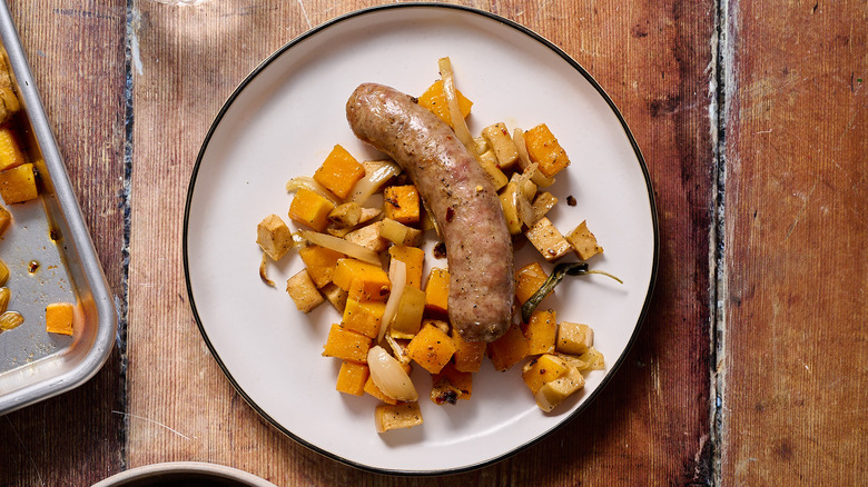 sausage, squash, and apples on white plate