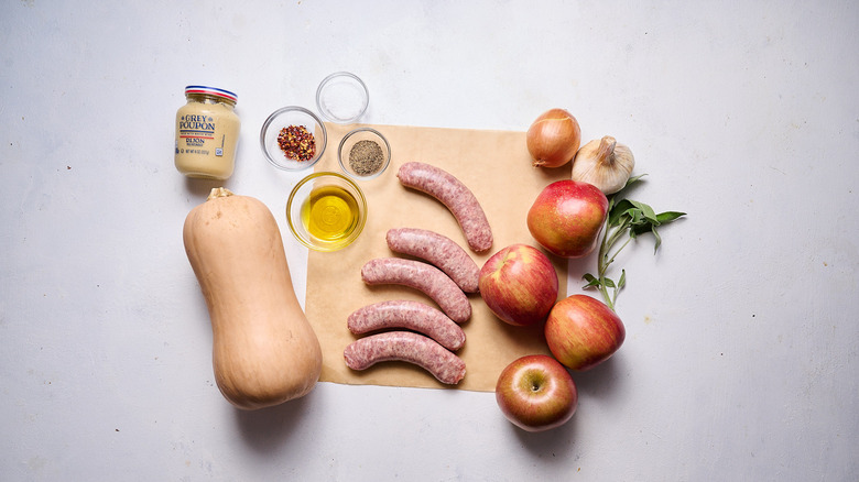 sheet pan sausage and apple ingredients on a table