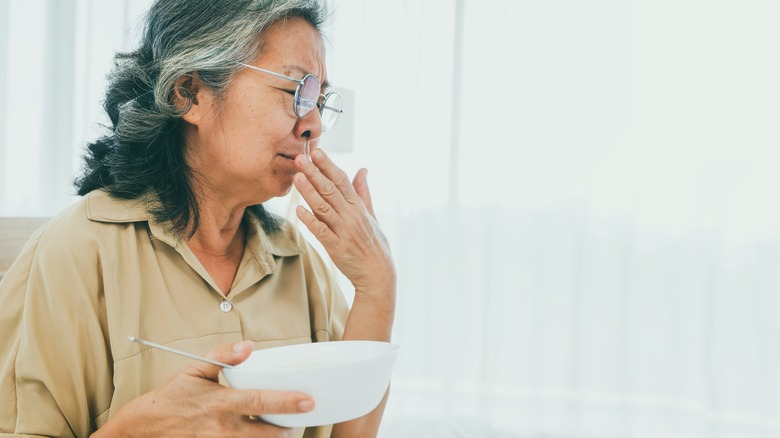 woman experiencing bad flavor