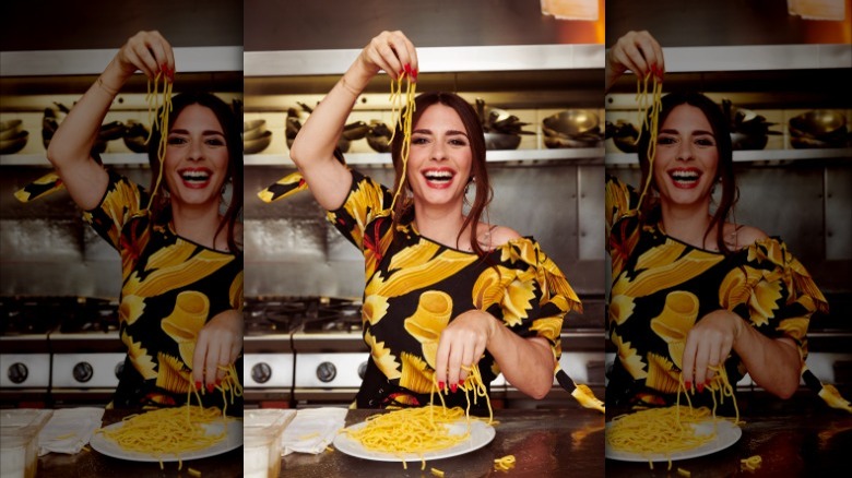 Nadia Munno holding up pasta