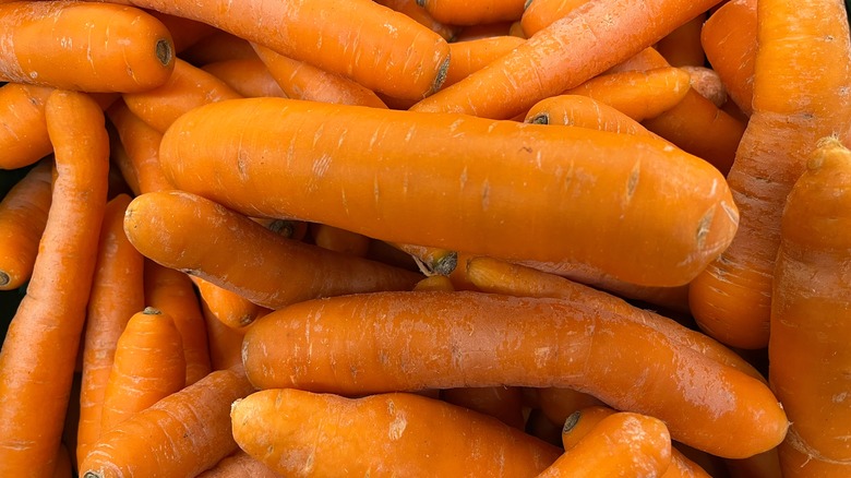bunch of unpeeled carrots