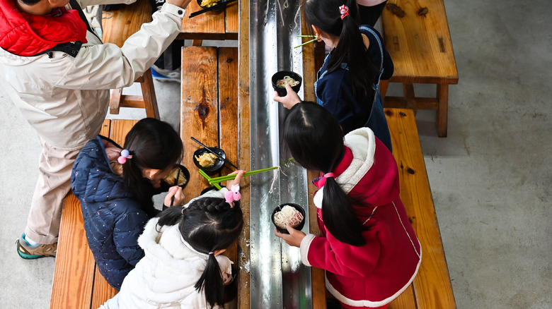 family eating nagashi somen