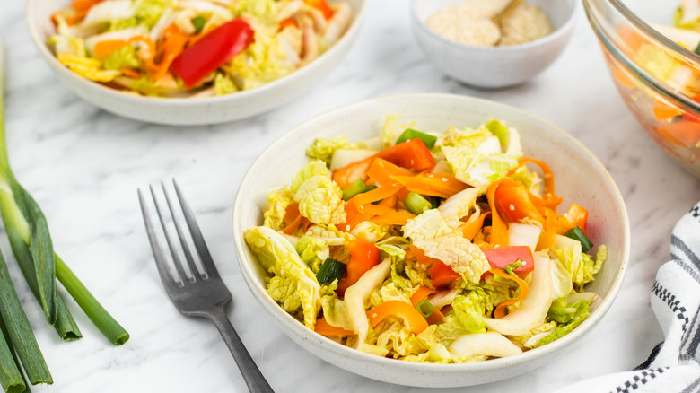 napa cabbage salad in bowls 