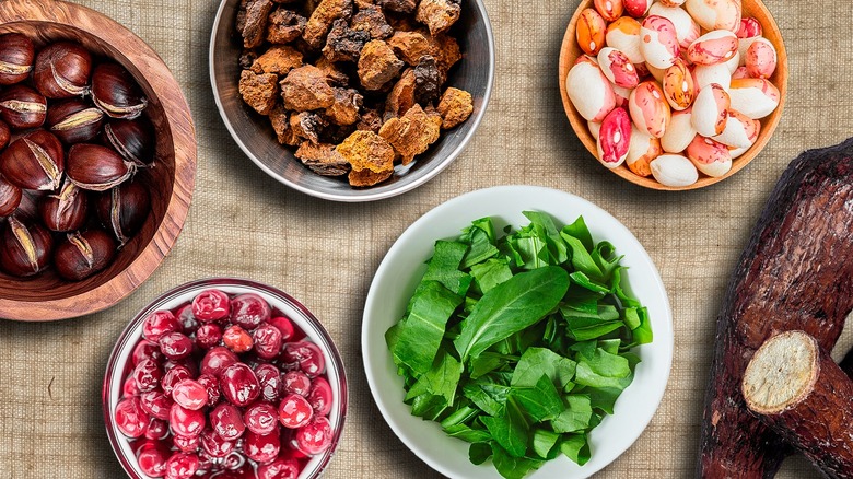 Native American ingredients in dishes on tablecloth