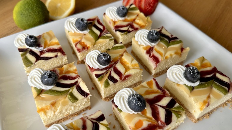 Naturally rainbow cheesecake bars on platter
