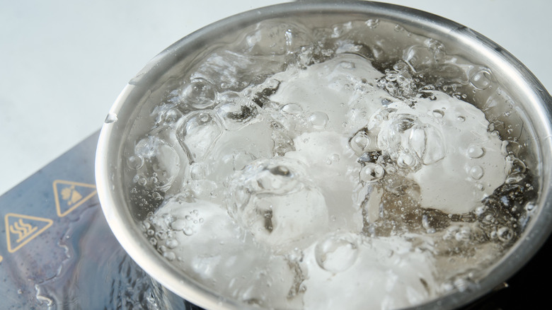 eggs boiling in pot of water