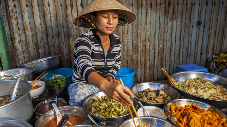 Woman preparing Vietnamese street food