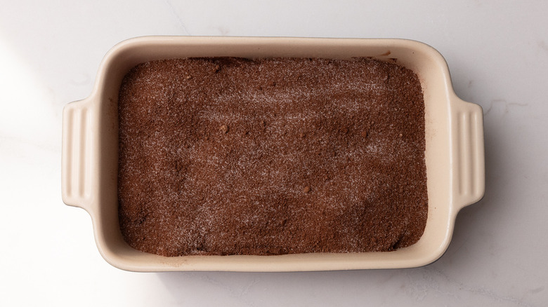 topping sprinkled over cobbler batter