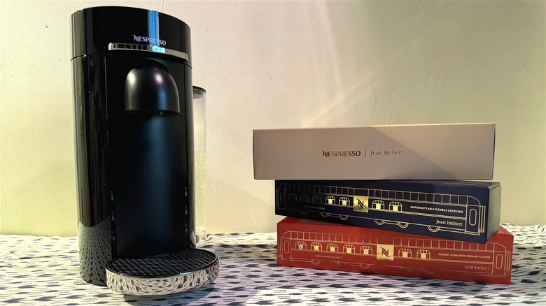 Nespresso Unforgettable Holidays Collection next to Vertuo machine