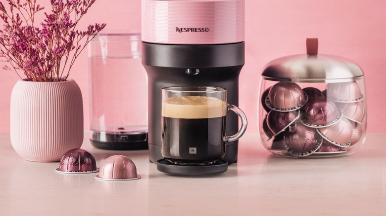 candy pink Nespresso Vertuo Pop+ machine on pink background