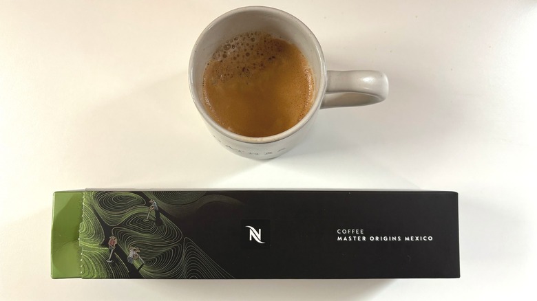 A cup of Nespresso Master Origins Mexico coffee above a box of pods