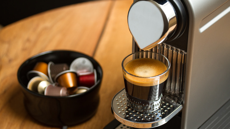 Nespresso machine dispensing coffee