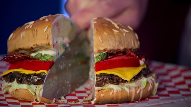 cutting into realistic burger cake