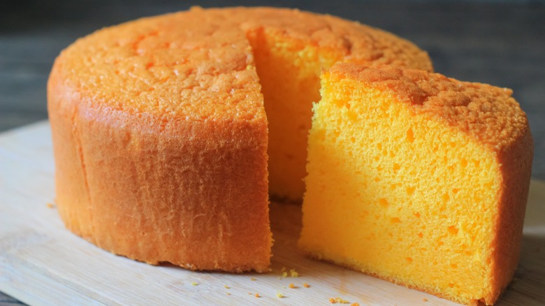 Close up of chiffon cake with a cut slice 