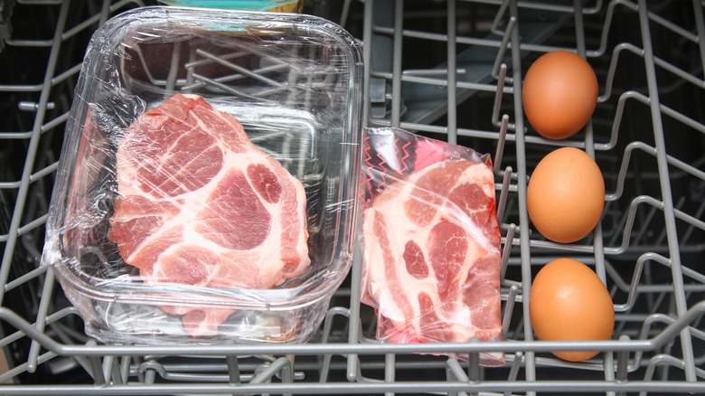 meat and eggs being cooked in a dishwasher