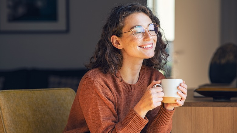 person enjoying coffee at home 