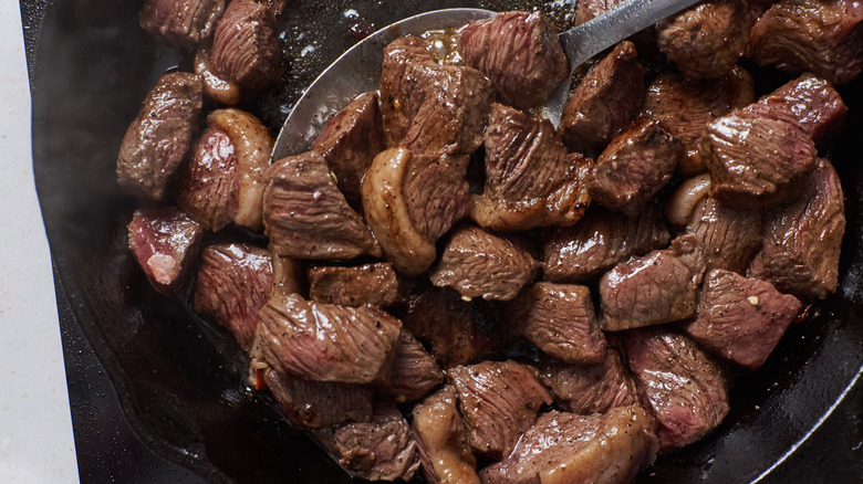 searing steak tips in cast iron skillet