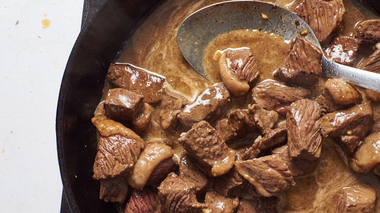 melting butter into skillet