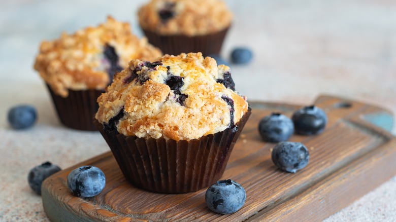 Blueberry muffins on cutting board