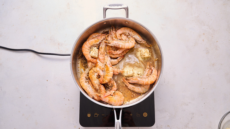 adding butter to skillet