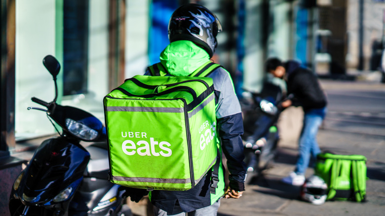 delivery driver carrying food bag