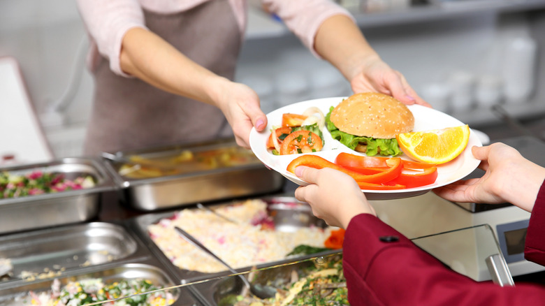 A student receives a healthy lunch in cafeteria