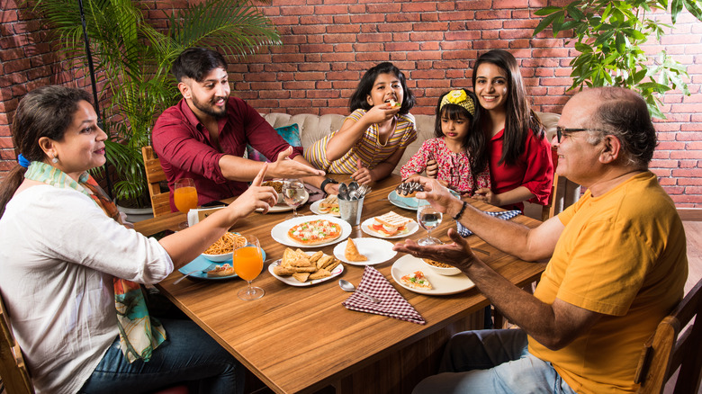 Family eating dinner at restaurant 