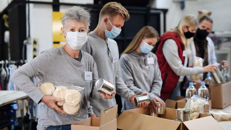 volunteers sort donations at food pantry