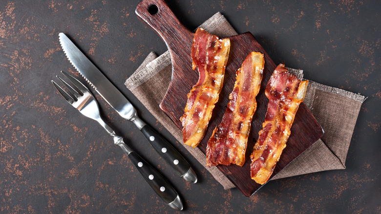 fried bacon on cutting board